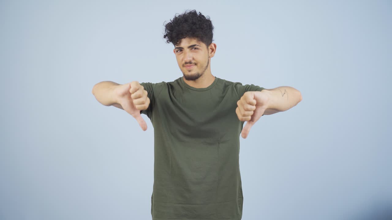 Man looking at camera with a negative expression.