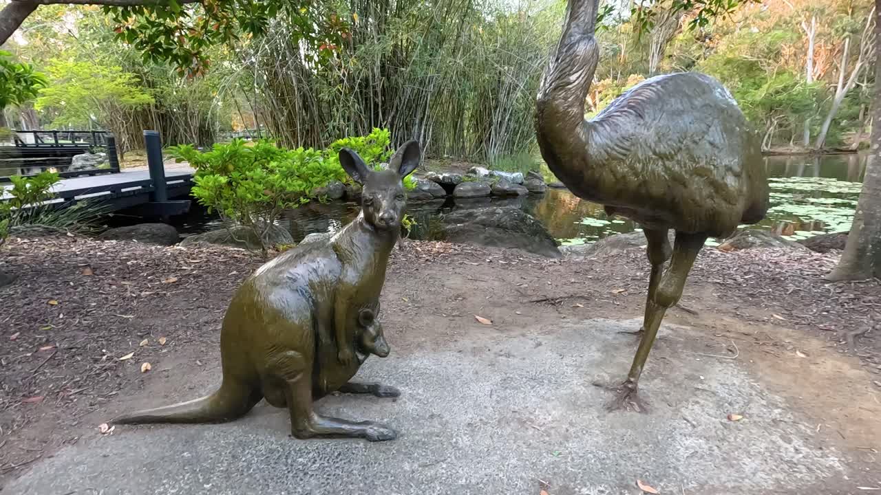 Bronze kangaroo and emu statues in botanical garden