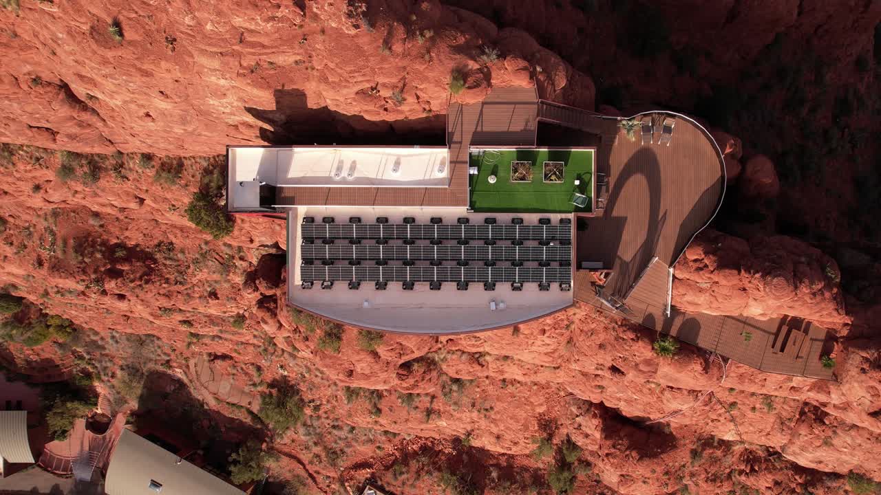 Hilltop House With Solar Panels, Modern Building Atop Sandstone Cliff in Landscape of Sedona USA, Top Down Aerial View