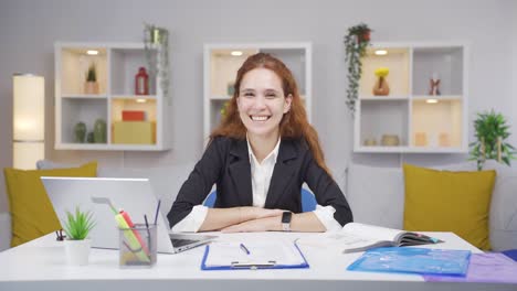 home office worker woman winks at camera.