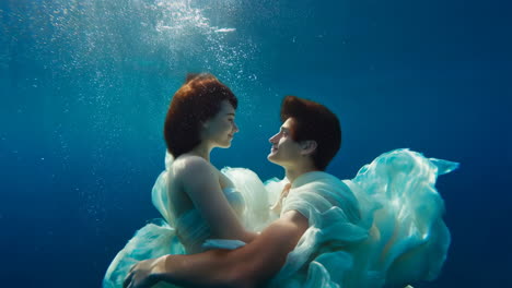 ethereal underwater embrace of a couple