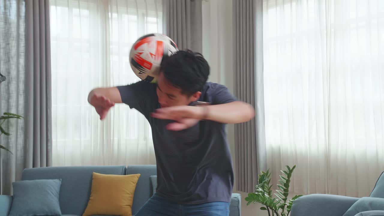 Asian Man Show Skill With Soccer Ball In Living Room, Soccer Freestyle