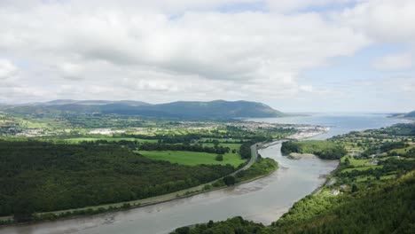 aerial flight of the flagstaff viewpoint area, countryside, newry, with warrenpoint town in the distance during the summer