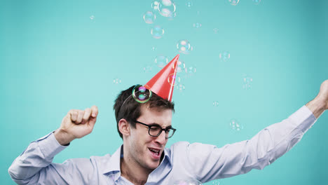 Crazy-face-man-dancing-in-bubble-showerslow-motion-photo-booth-blue-background