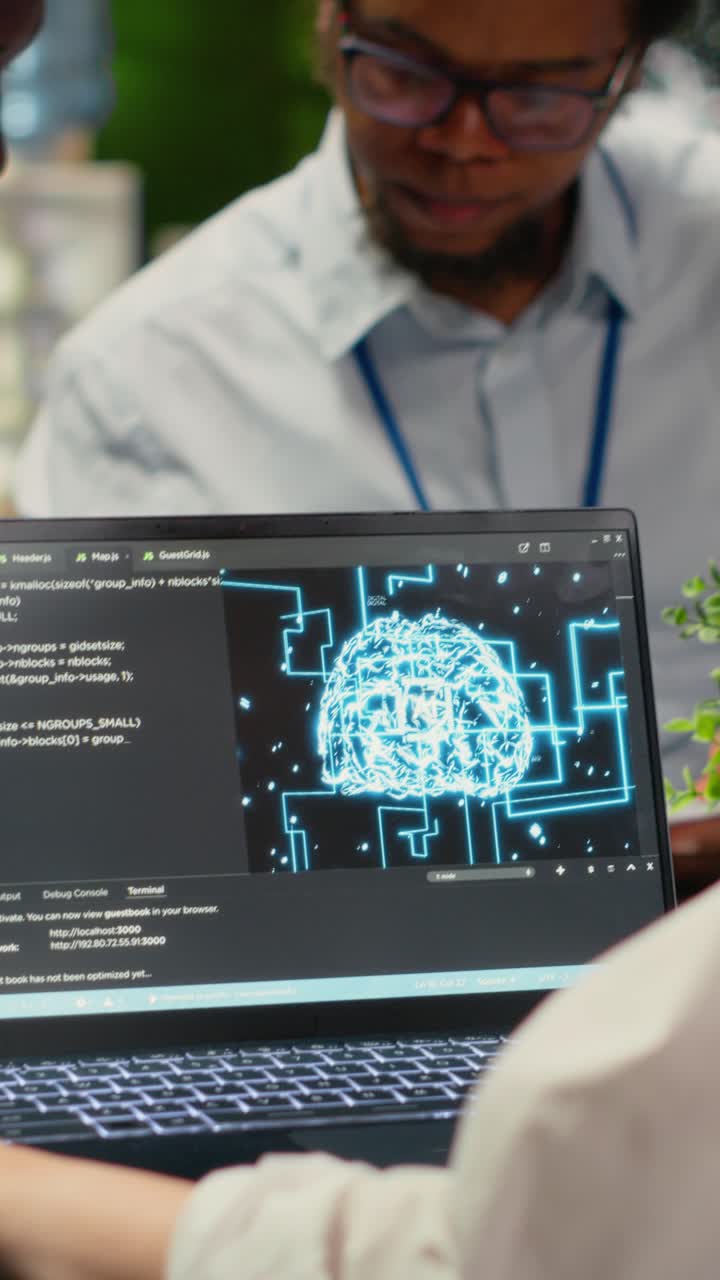 Vertical video Programmers in office using specialized technology to accelerate AI calculations