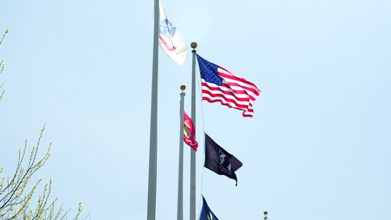 American Flag Waving with New Jersey and Other Flags in Clear Sky in Slow Motion