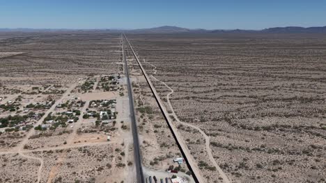 aerial view of the border wall between mexico and the united states, located in sonoyta, sonora on the mexican side and arizona on the us side.