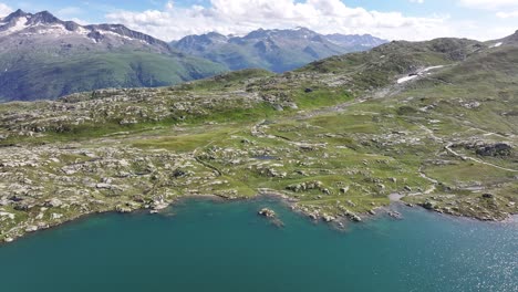 aerial view of totensee, a high mountain lake situated near the famous susten-furka-grimsel pass in switzerland