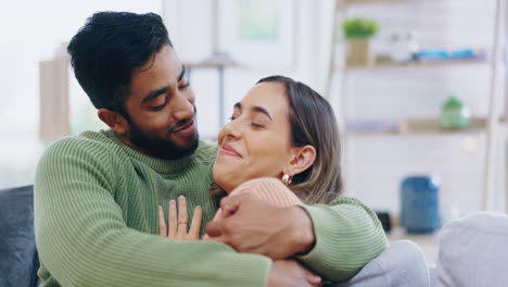 happy, kiss and couple on a sofa
