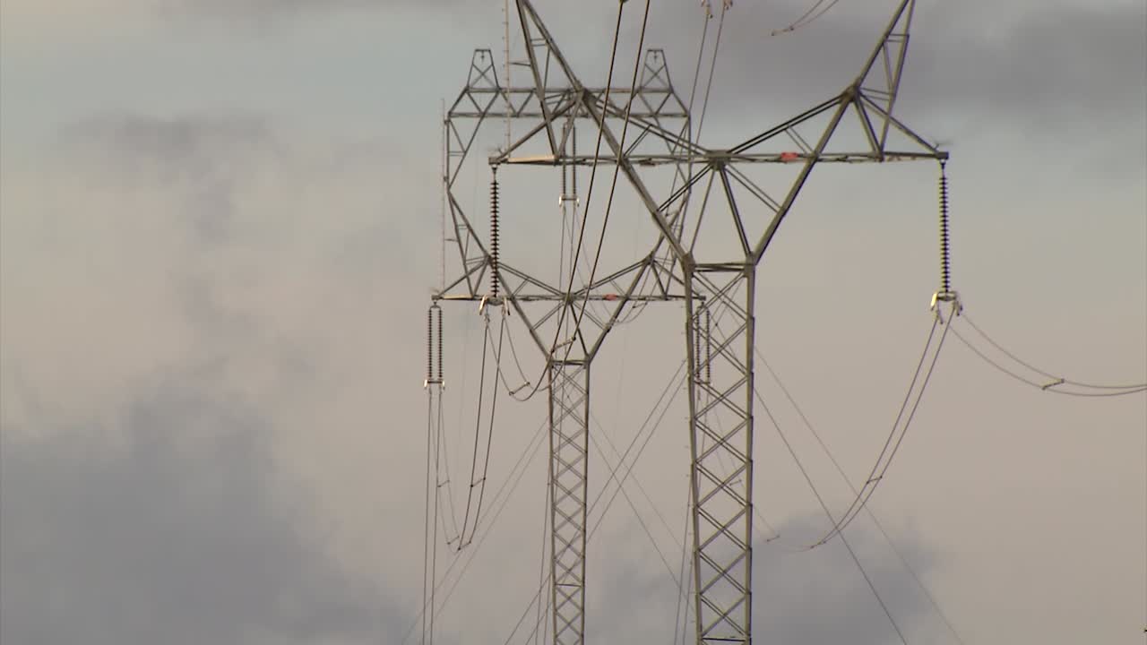 OVERHEAD POWER LINES TRANSFORMERS SIDE BY SIDE
