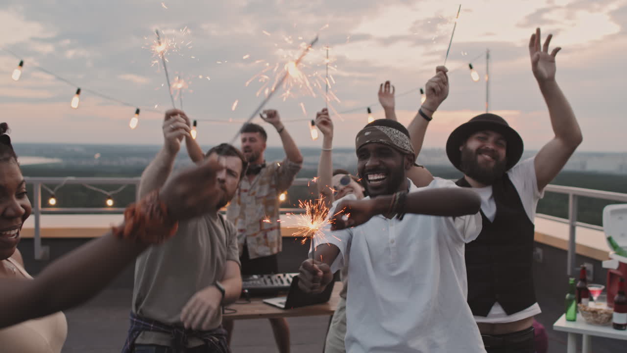 People with Sparklers Partying at Rooftop Party