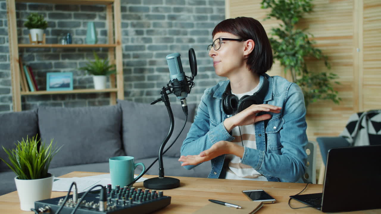 Woman recording a podcast at home