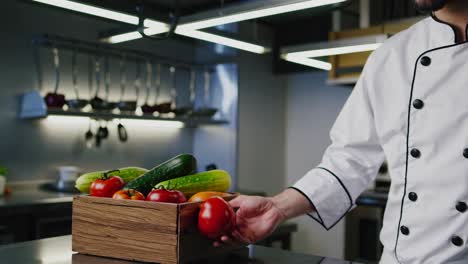 chef holding a tomato