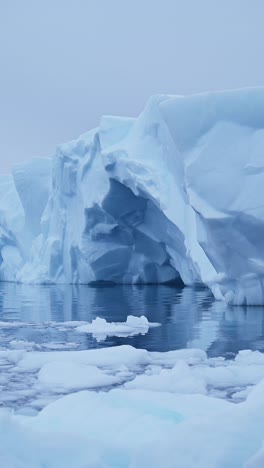 Blue-Iceberg-Ice-Formation-Close-Up-Detail-in-Antarctica,-Vertical-Nature-Video-for-Social-Media,-Instagram-Reels-and-Tiktok-of-Sea-Icebergs-Amazing-Beautiful-Patterns-in-Antarctic-Peninsula-Ocean