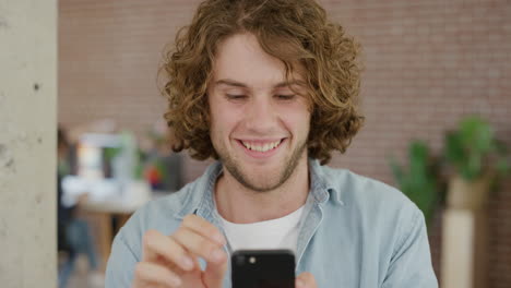 portrait of handsome young man student using smartphone enjoying texting browsing online social media network reading messages on mobile phone connection smiling satisfaction