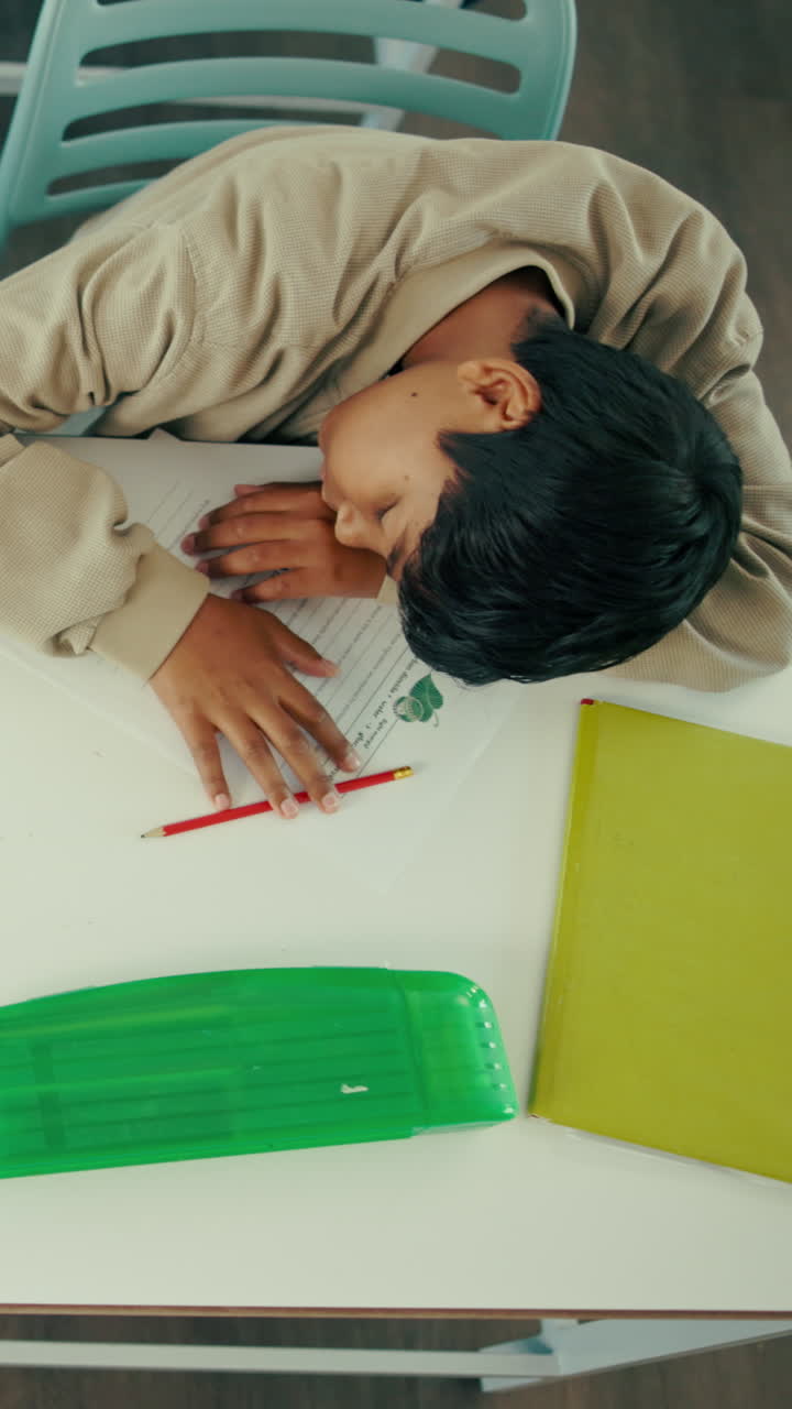 Tired Students Sleeping on Desks in a Classroom