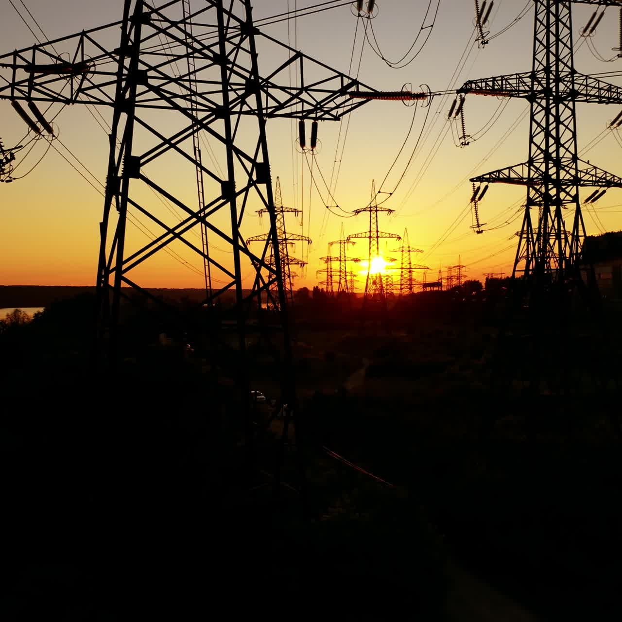 Power lines on colorful sunset