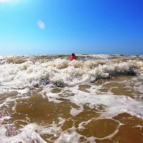 boy having fun in sea
