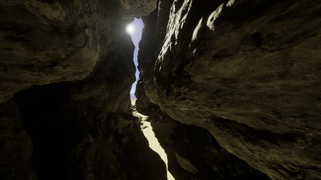 Bright sunlight filters through a narrow rock crevice in a desert landscape