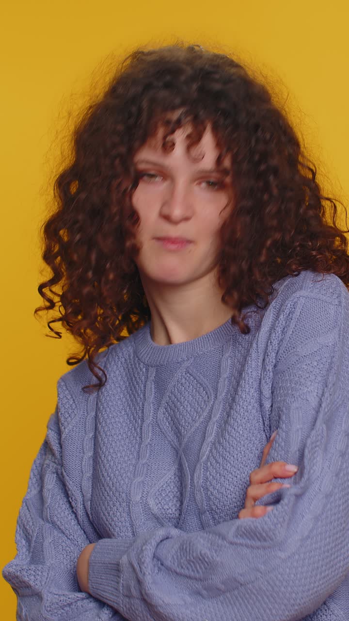 Cheerful funny bully woman showing tongue making silly faces fooling around joking teasing