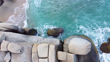 Overhead-View-of-Boulders-Touching-the-Edge-of-Shoreline-in-Columbia