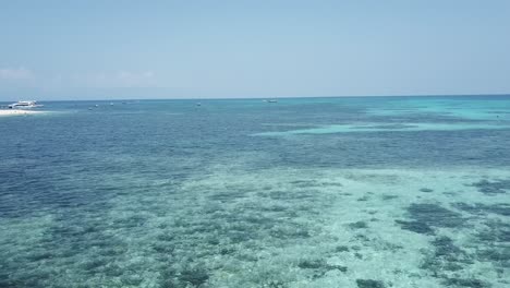 drone aerial near blue tropical water on a sunny summer day