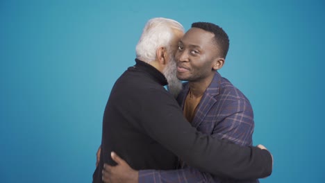 Christian-man-and-muslim-african-young-man-shaking-hands-and-hugging-each-other.