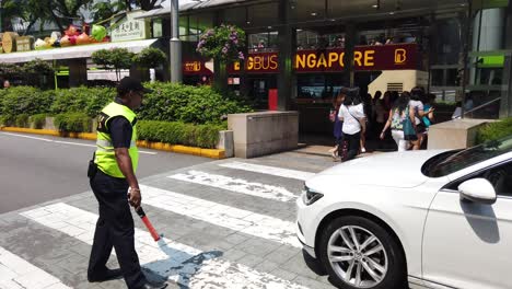 singapore street scene with security guard