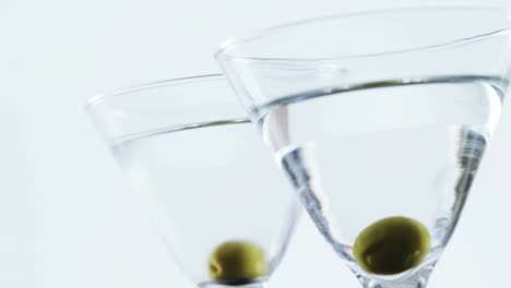 Two-glasses-of-cocktail-garnished-with-a-olive-