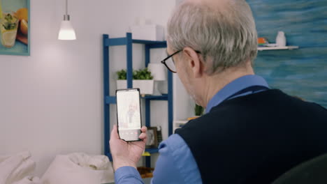 Senior-business-man-discussing-during-video-conference-with-remote-doctor