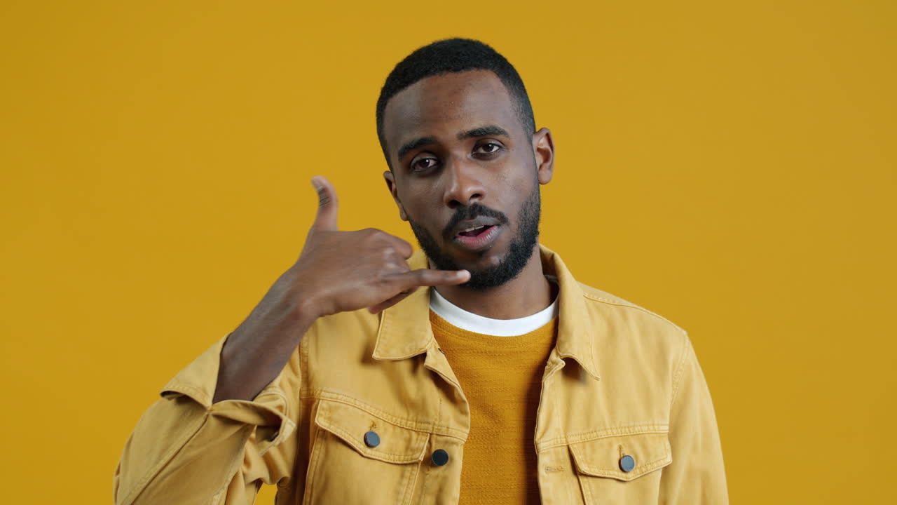 Man making a phone gesture