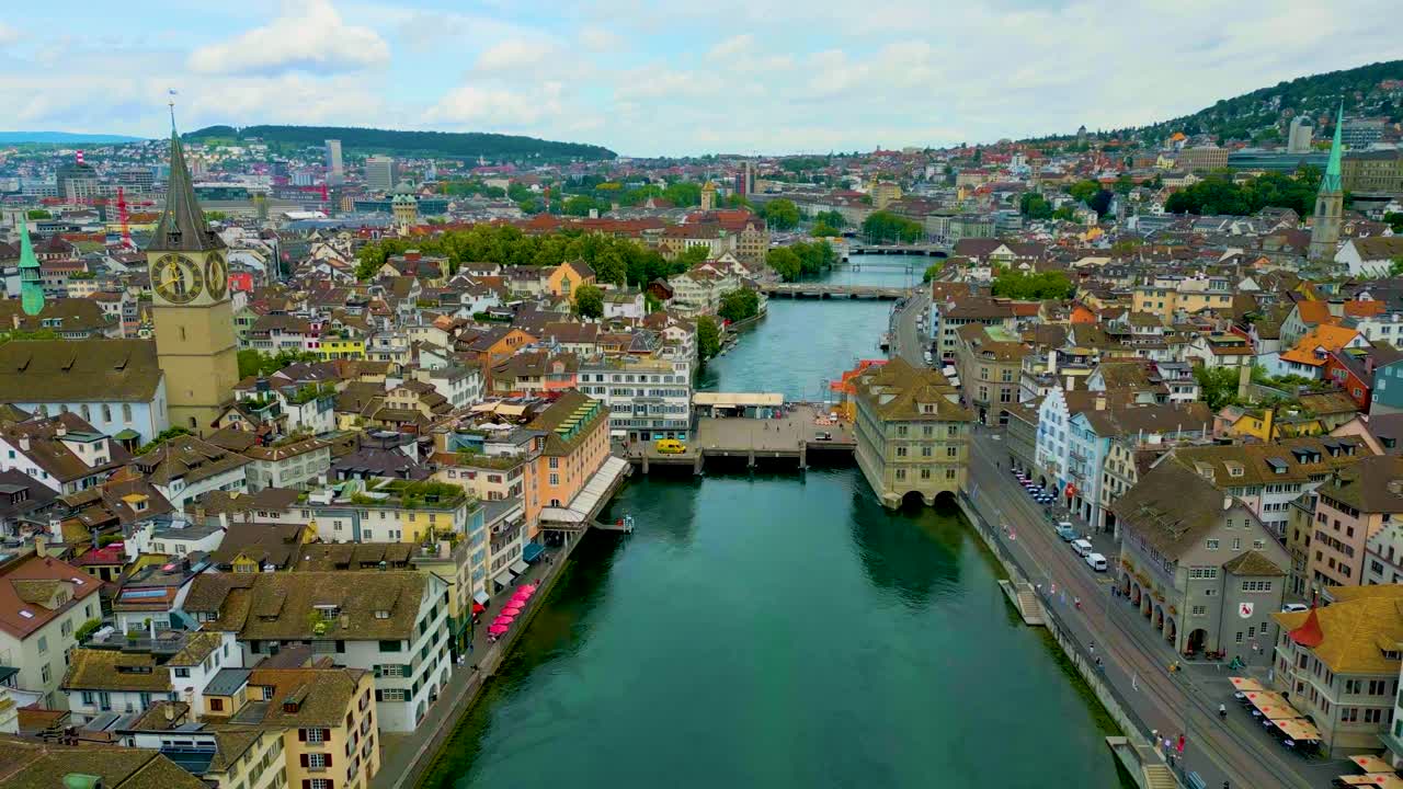 4K Drone Video of the Quaibrücke, Münsterbrücke, and Rathausbrücke Bridges over the Limmat River in Downtown Zurich, Switzerland