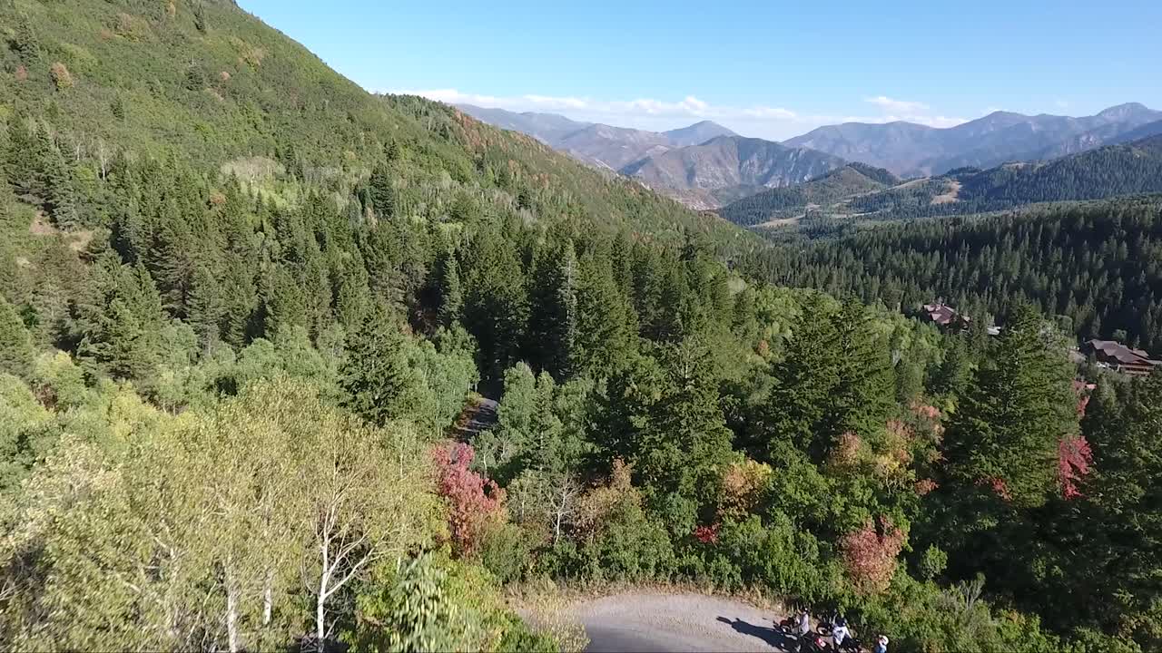 Aerial View of Mountain Road with Hikers