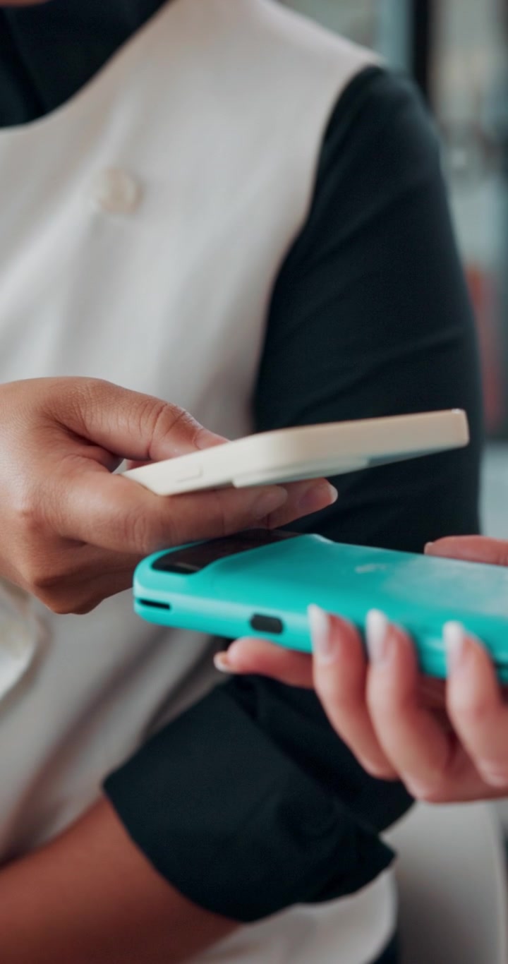Customer Making Contactless Payment with Smartphone at Point of Sale
