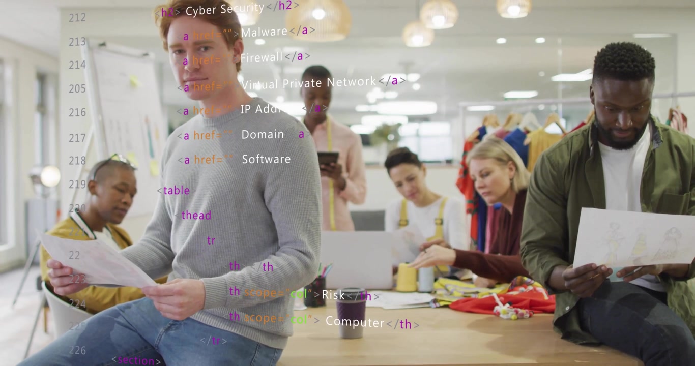 Designers reviewing sketches around wooden table in fashion studio, showing animated HTML overlay