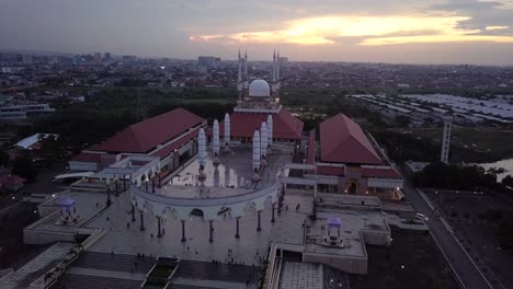 orbit drone shot of the great mosque of central java in suset time