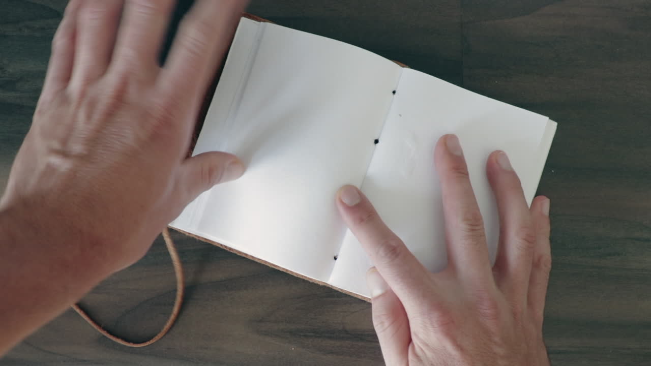 Opening vintage leather notebook point of view