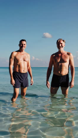 two men enjoying a playful day at the beach