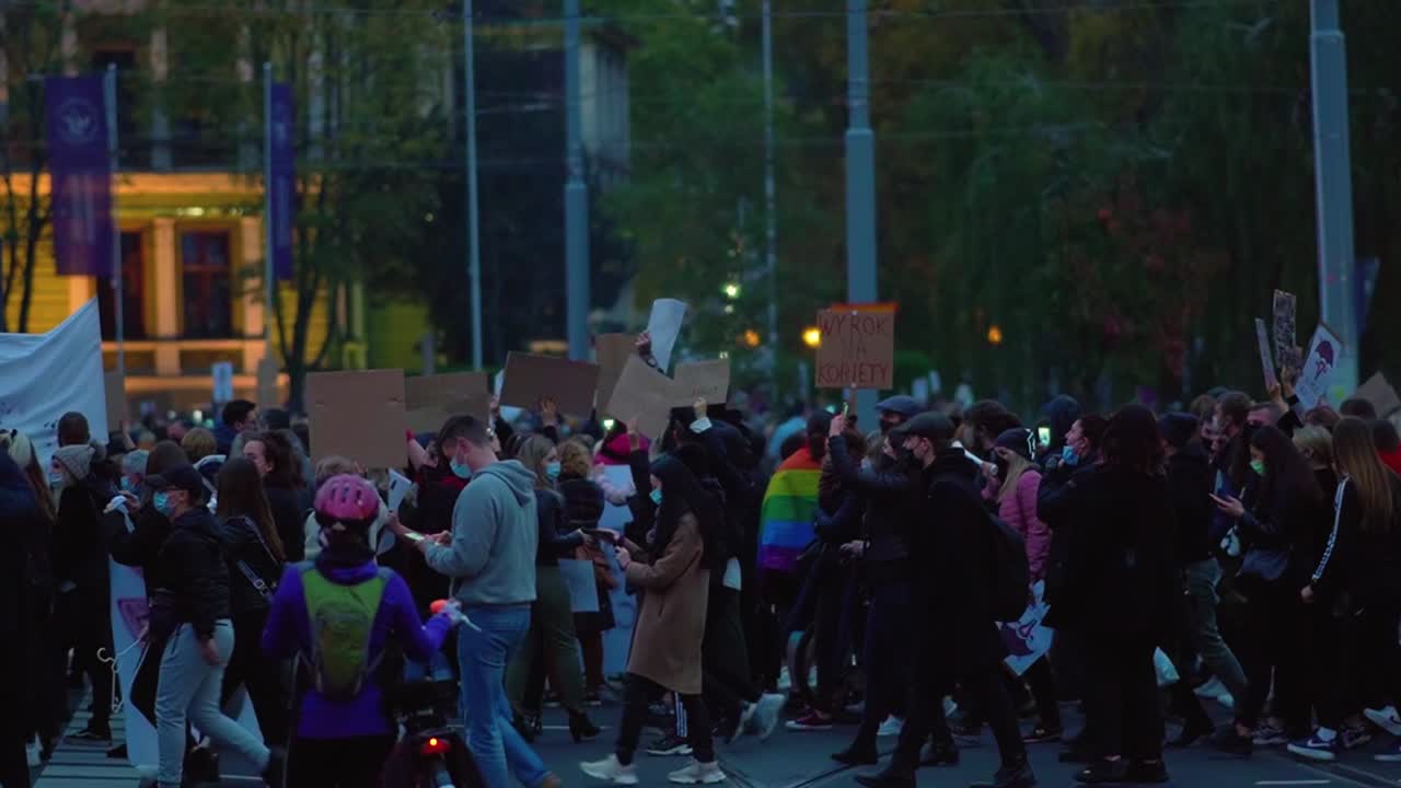 Total Ban Abortion Protest In Poland - Hundreds Of Polish People Carrying Placards Demonstrating Protest At Night In The Street Of Szczecin. - wide shot