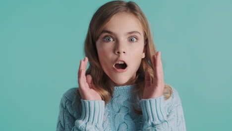 surprised teenage caucasian girl in front of the camera.