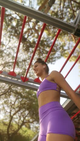 athletic woman training on outdoor obstacle course
