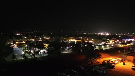 Tehachapi-City,-California-at-night---ascending-aerial-view