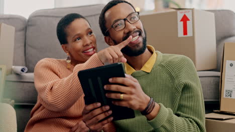 Couple,-tablet-and-new-house-on-floor-for-point