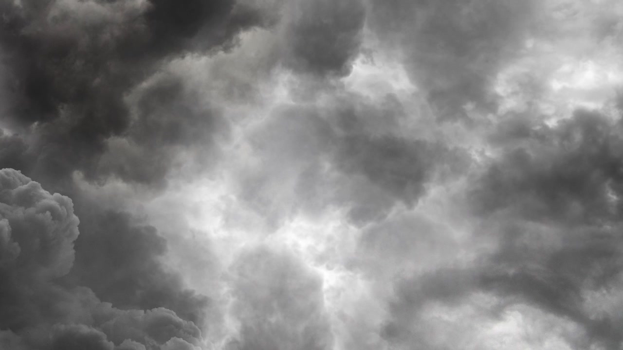 dark clouds and lightning strikes in the sky