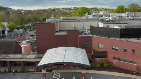 aerial pullback reveals hospital emergency room entrance