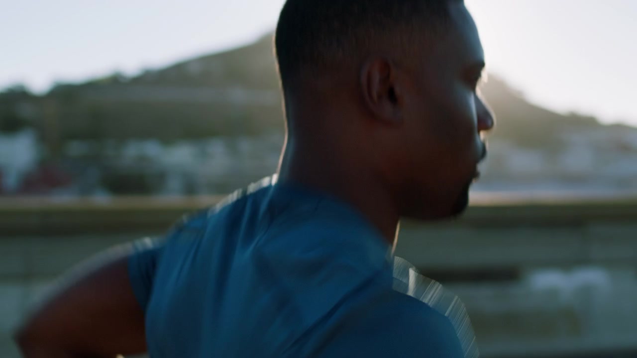 Young Man Jogging Outdoors During Golden Hour