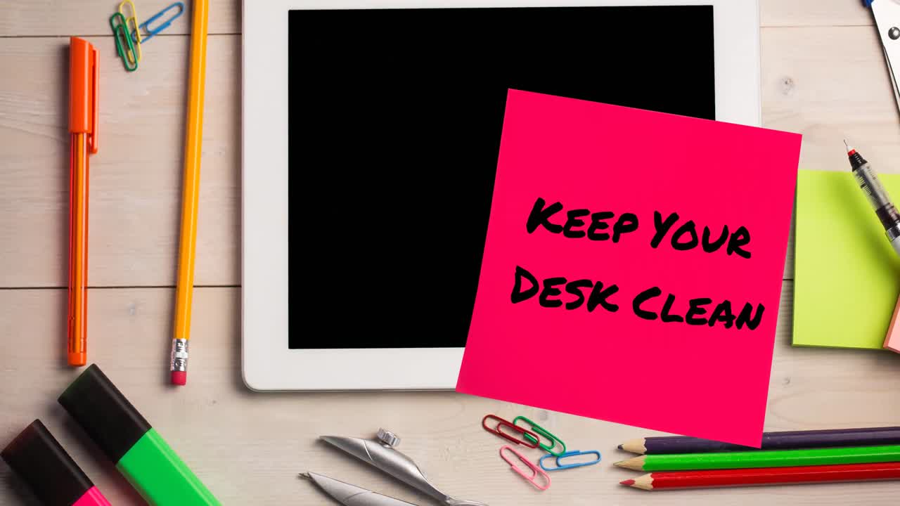 Animation of keep your desk clean text on memo note over tablet on desk