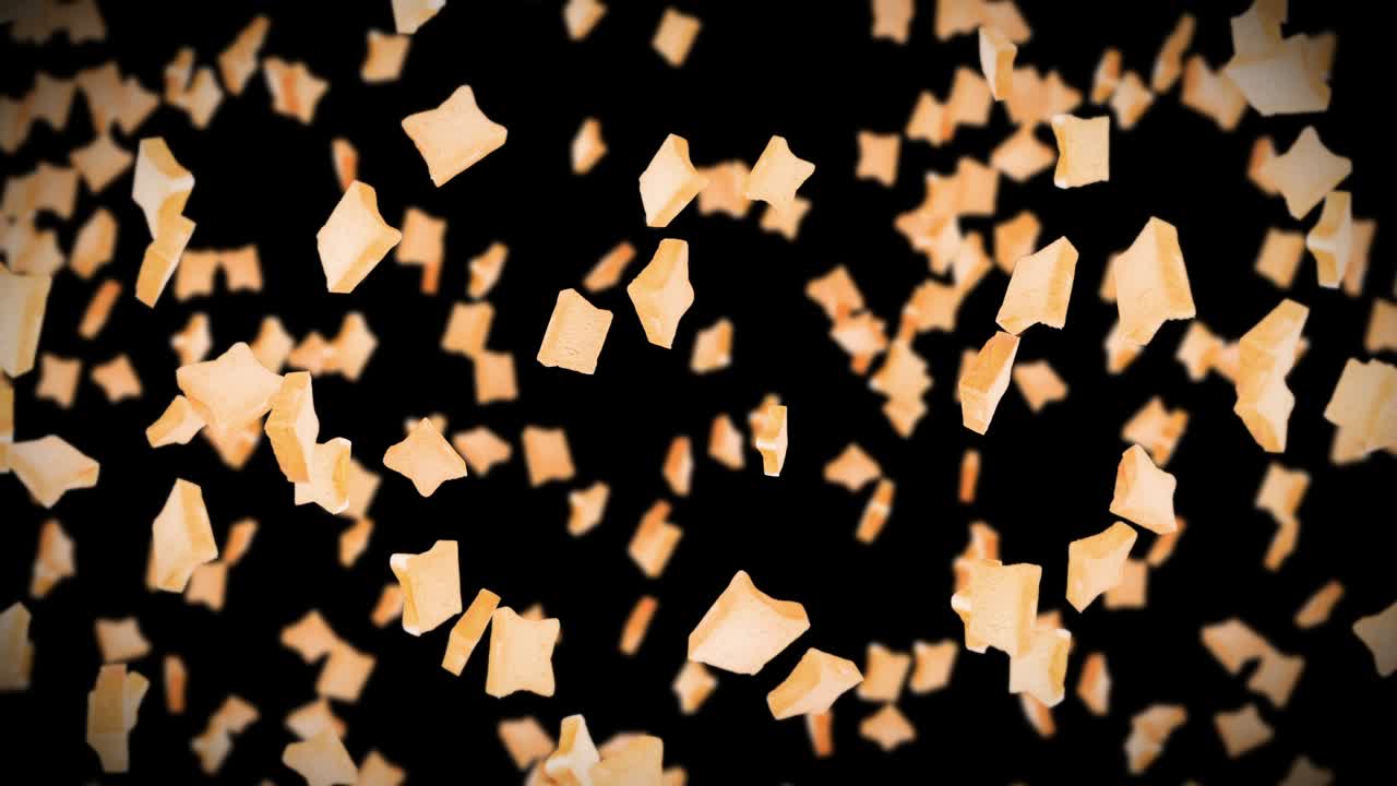 검은색 바탕에 많은 평평한  조각을 날아. 식품, 음식 및 먹는 개념. 밀 조각의 3d 애니메이션 회전. 루프 애니메이션.