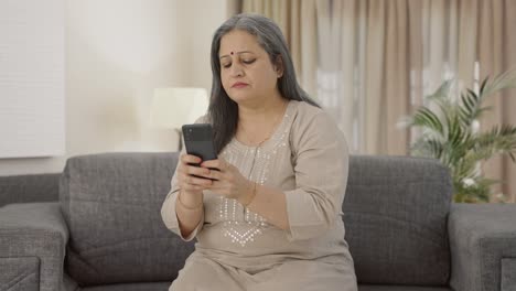 Indian-old-woman-texting-someone