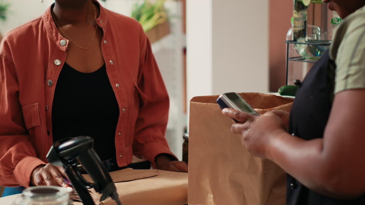 Woman paying for bulk products with card at pos